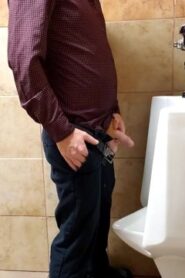 Watch – Ginger business man peeing at urinal