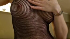 Watch – A fit girl showing around a presidential suite in her sexy fishnet bodysuit